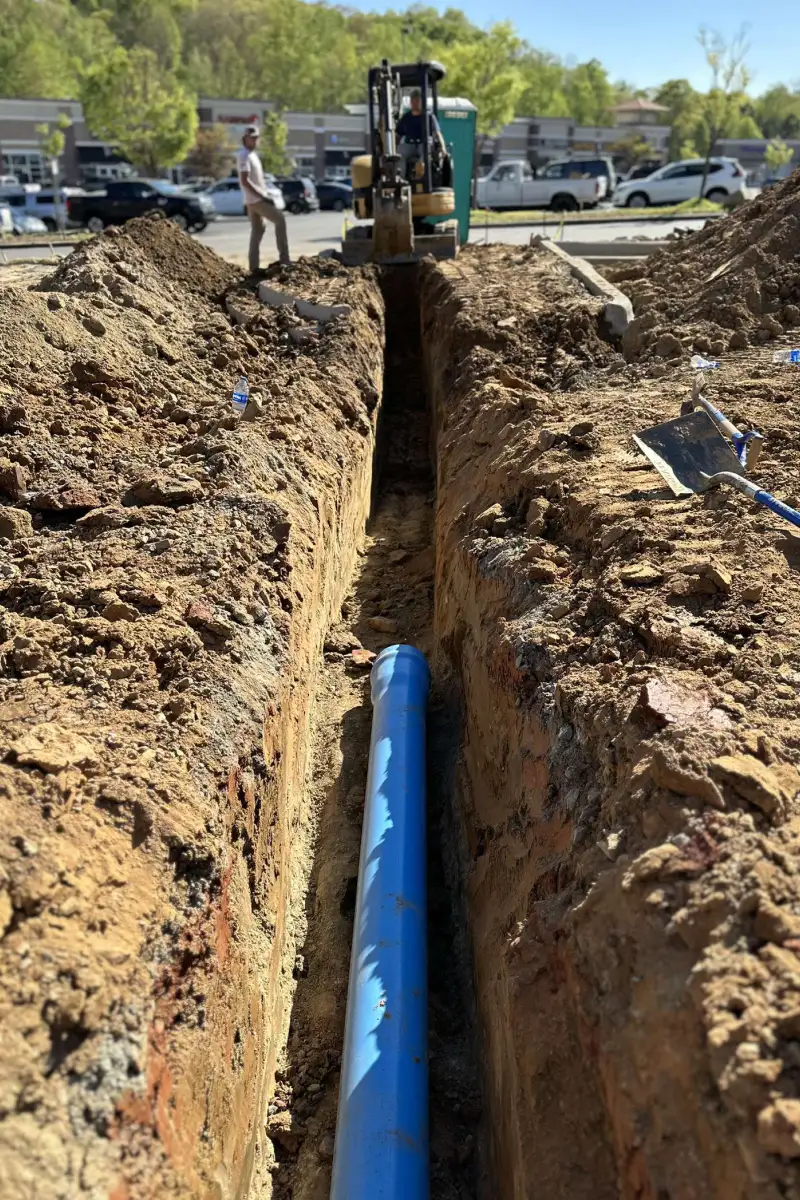 excavator digging a trench